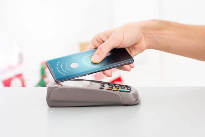 Arizona Money Transmitter Bond - Contactless mobile payment. Payment terminal and smartphone.
