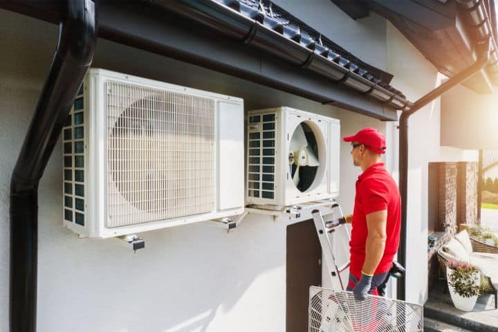 Alabama Heating and Air Conditioning Contractor Bond ($15,000) - HVAC technician performing air conditioning and heat pump units.