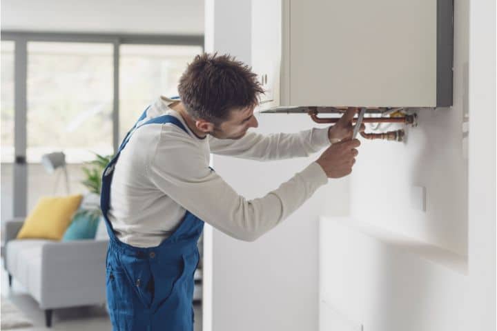 Mountain Brook, AL-Plumber or Gas Fitter Contractor Bond ($10,000)-A professional plumber checking a boiler.