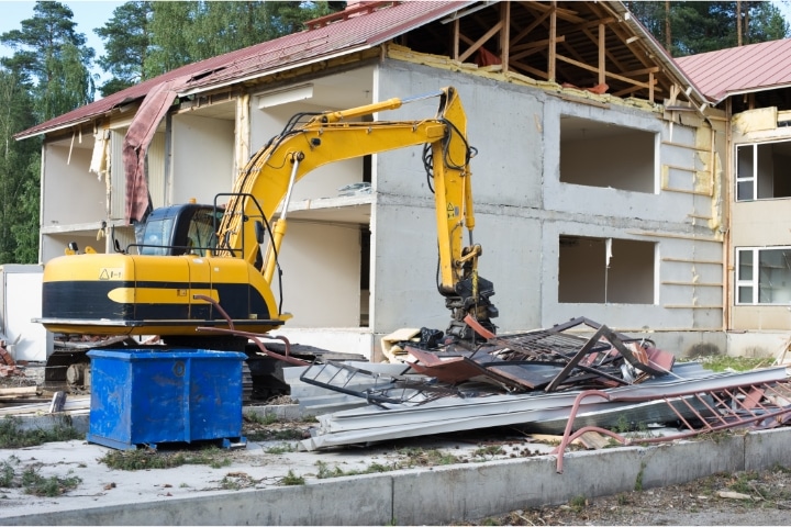 Pasco County, FL - Demolition Contractor ($5,000) Bond - A demolition work from an excavator.