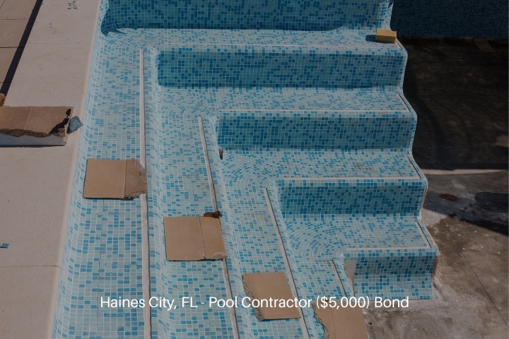 Haines City, FL - Pool Contractor ($5,000) Bond - A swimming pool being tiled during construction.