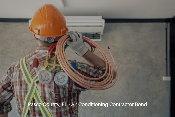 Pasco County, FL - Air Conditioning Contractor Bond - Air conditioning technician ready to install new air conditioner.