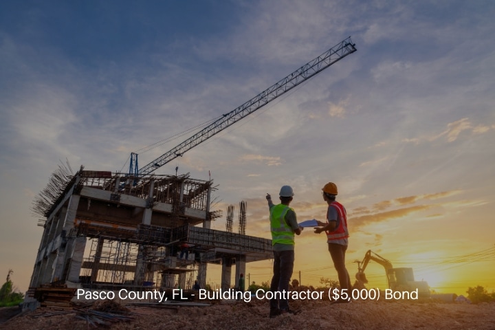 Pasco County, FL - Building Contractor ($5,000) Bond - Civil engineer and worker checking project at building site.