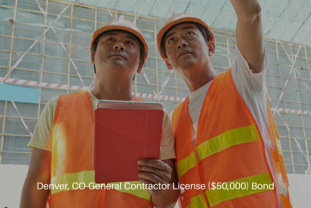 Denver, CO-General Contractor License ($50,000) Bond - General contractor with a tablet computer explaining the plan of work to colleagues.
