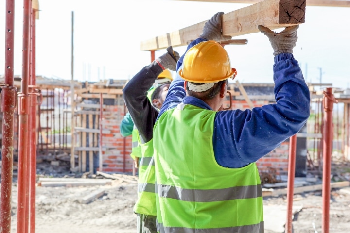 Pasco County, FL - Building Contractor ($5,000) Bond - Construction worker on building site.