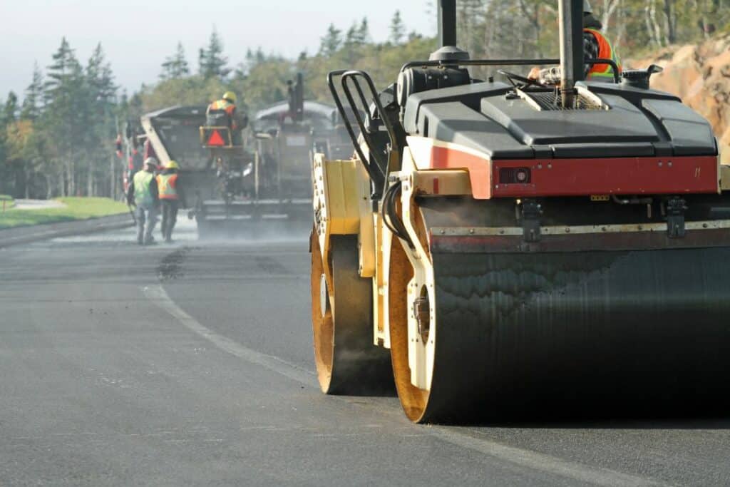 Ridgefield, CT-Street Opening Bond - Road construction. Busy contractor putting asphalt.