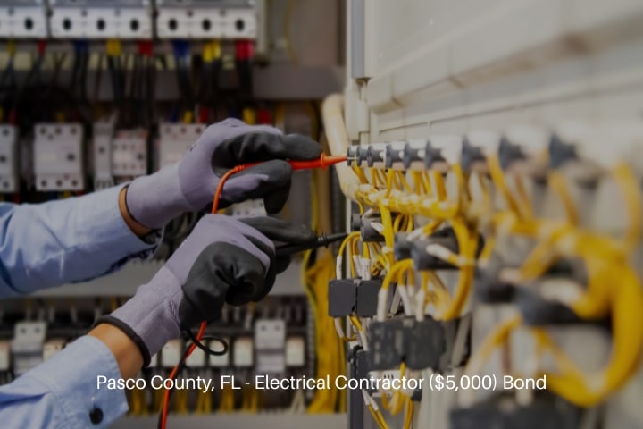 Pasco County, FL - Electrical Contractor ($5,000) Bond - Electrical engineer using digital multi-meter measuring equipment.
