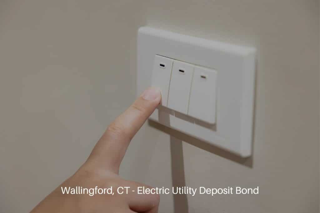 Wallingford, CT - Electric Utility Deposit Bond - People press the light switch to turn off the light for saving home energy.