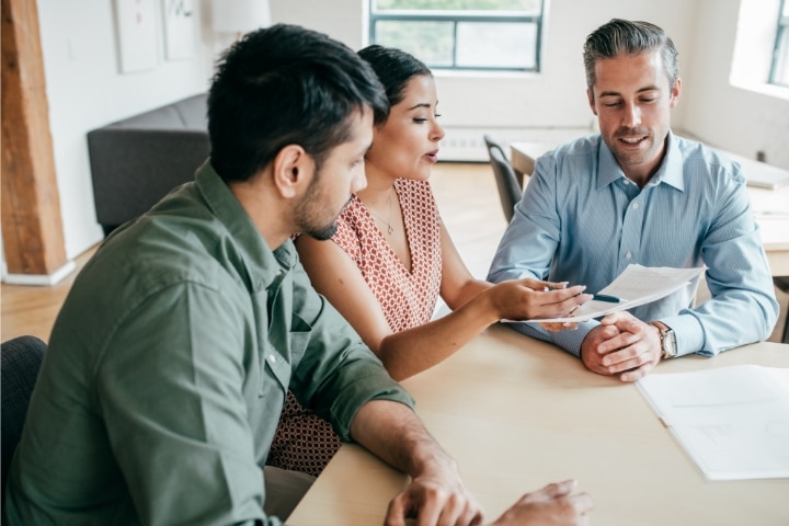 Connecticut Mortgage Lender Bond - A couple and an agent discuss about their mortgage.