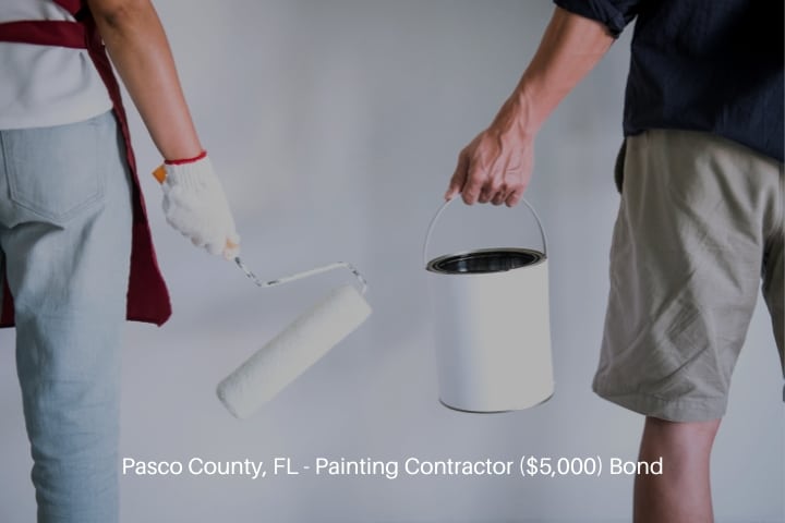 Pasco County, FL - Painting Contractor ($5,000) Bond - Two people ready to paint the wall with paint roller.