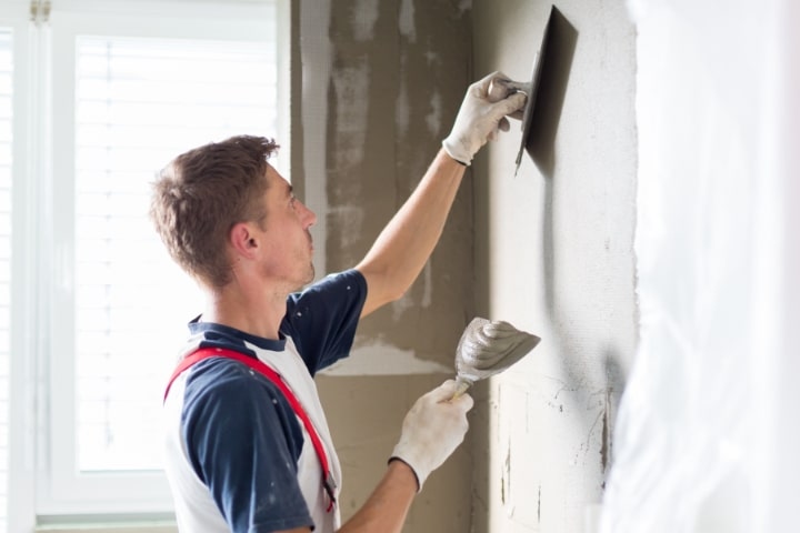 Pasco County, FL - Plastering and Stucco Contractor ($5,000) Bond - Plasterer renovating indoor walls.