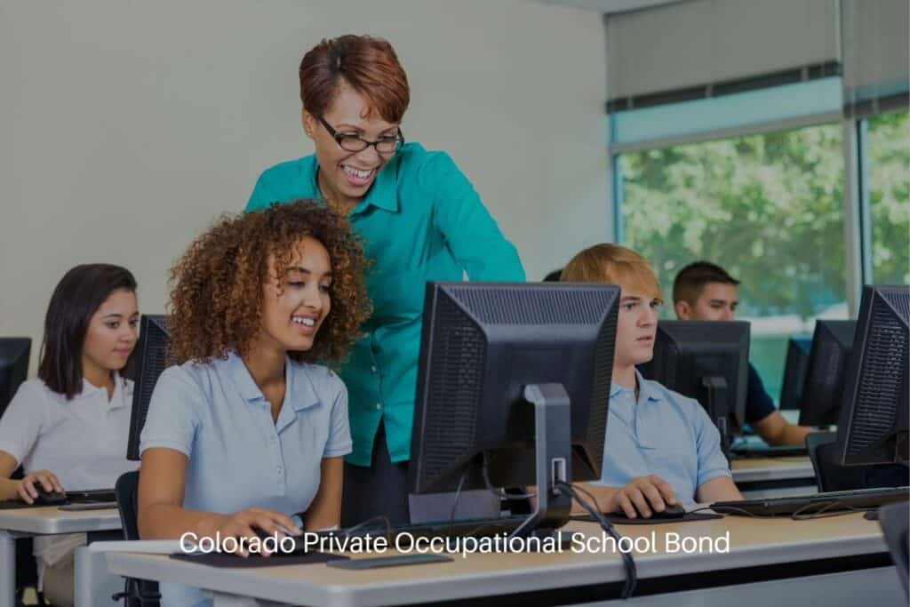 Colorado Private Occupational School Bond - Professor in private high school computer lab teaching diverse students.