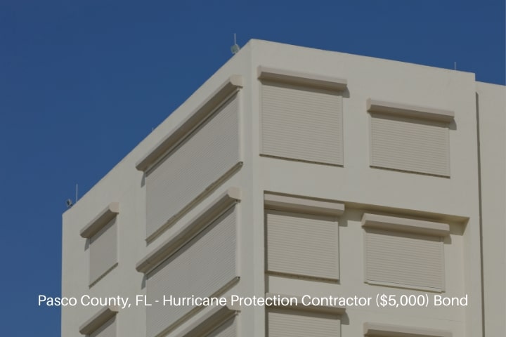 Pasco County, FL - Hurricane Protection Contractor ($5,000) Bond - Roll-up hurricane shutters installed in a Florida coastal building.