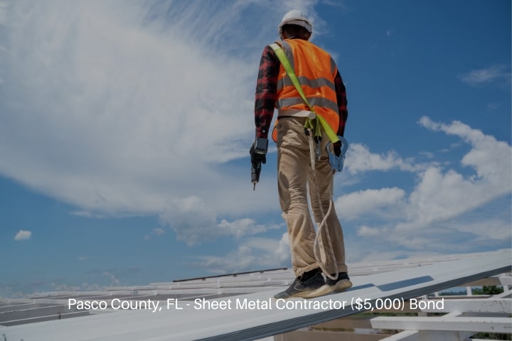 Pasco County, FL - Sheet Metal Contractor ($5,000) Bond - Roofer working at metal profile roof installation.