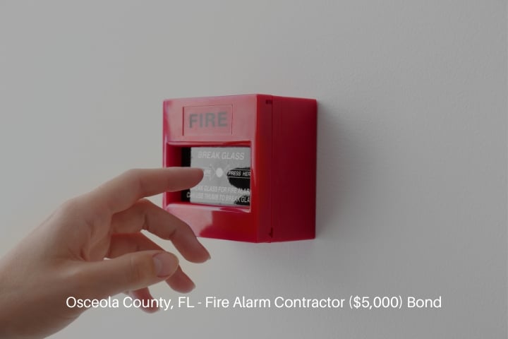 Osceola County, FL - Fire Alarm Contractor ($5,000) Bond - Woman using manual call point of fire alarm system.