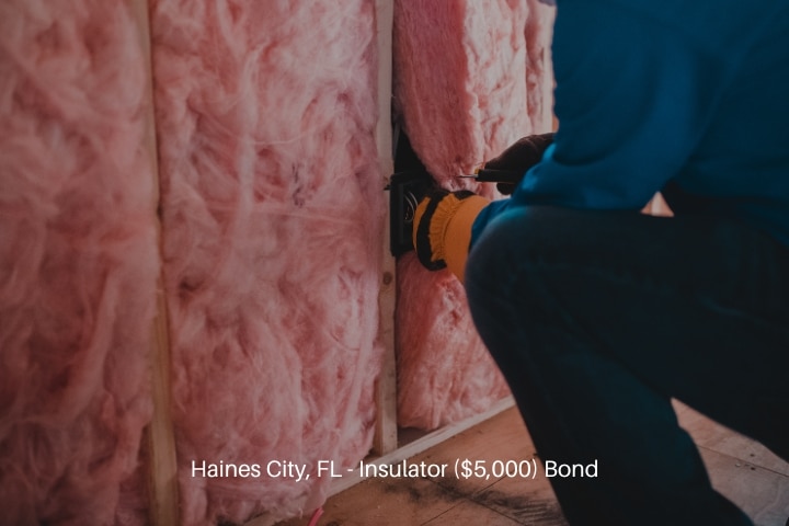 Haines City, FL - Insulator ($5,000) Bond - Worker insulating with stone wool.