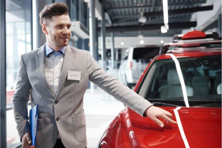 California Business Partner Automation (DMV) Bond - A good-looking salesman talking about car values.