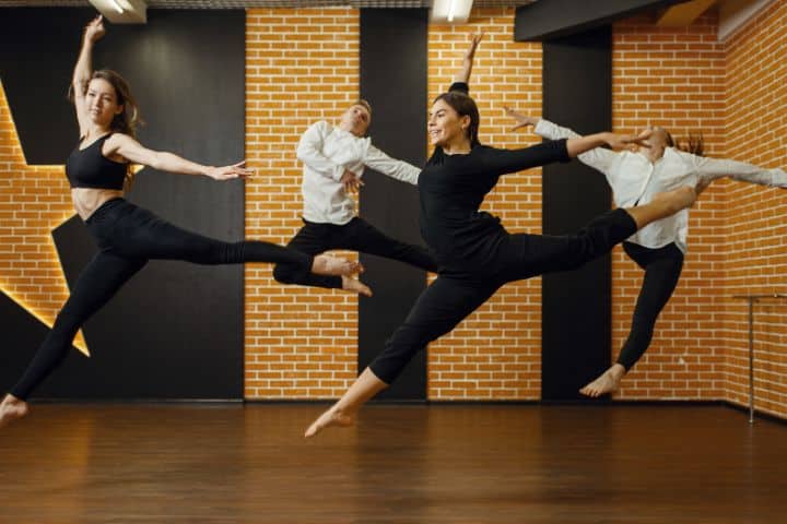 California Dance Studio ($25,000) Bond - Contemporary dance studio, performers in the jump.
