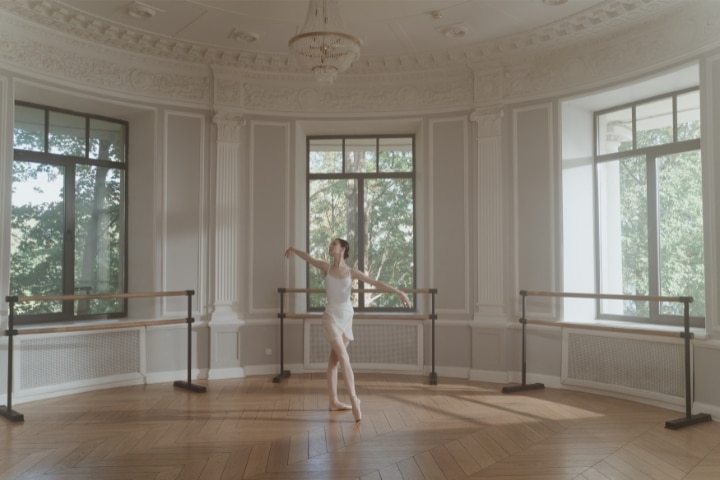 FL - Dance Studio ($10,000) Bond - A ballerina dancing in the studio.