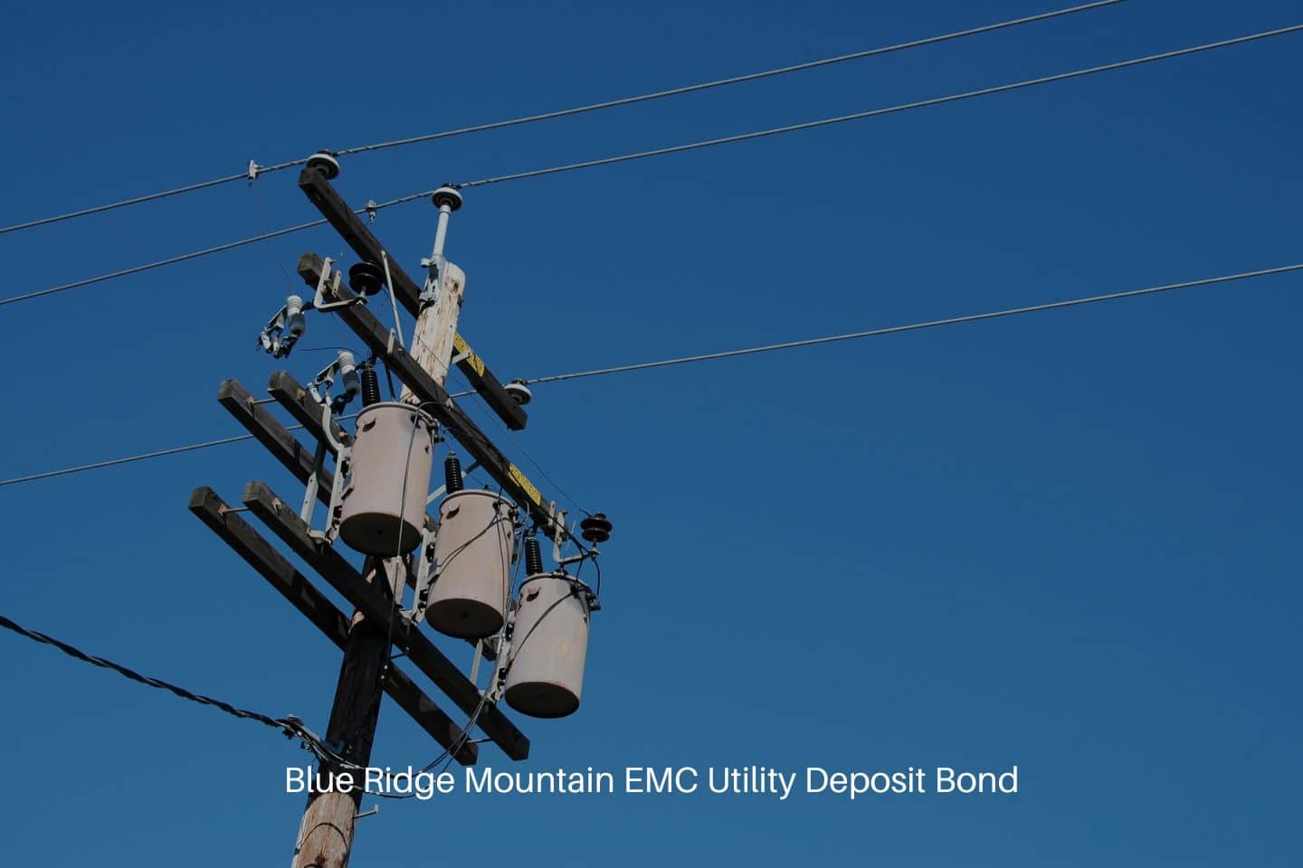 Blue Ridge Mountain EMC Utility Deposit Bond - Utility pole with blue sky in the background.
