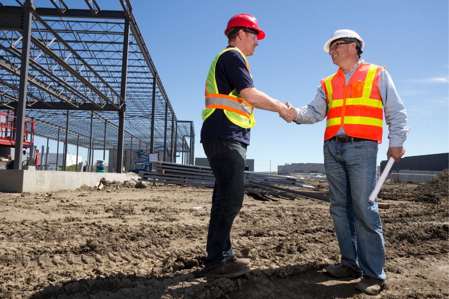 Atlanta, GA - Contractor's License Permit Bond - Construction industry of two contractors shaking hands.