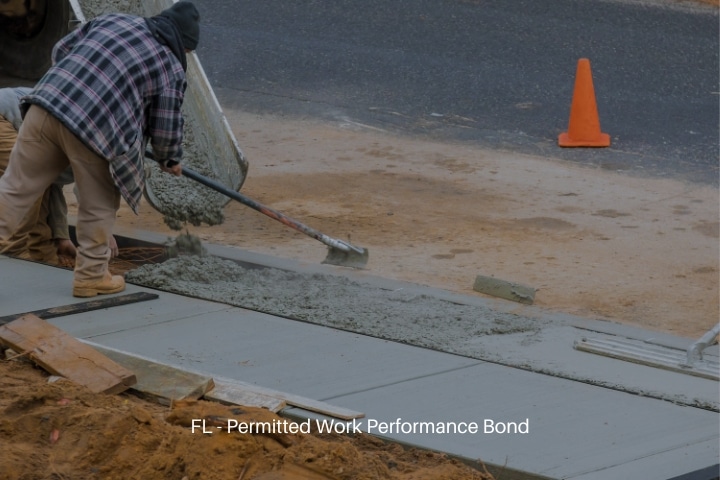 FL - Permitted Work Performance Bond - Man working on a new concrete driveway.