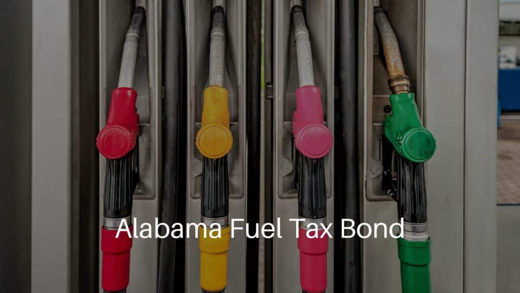 Alabama Fuel Tax Bond - Four fuel pistols on fuel station. Fuel distributor concept.