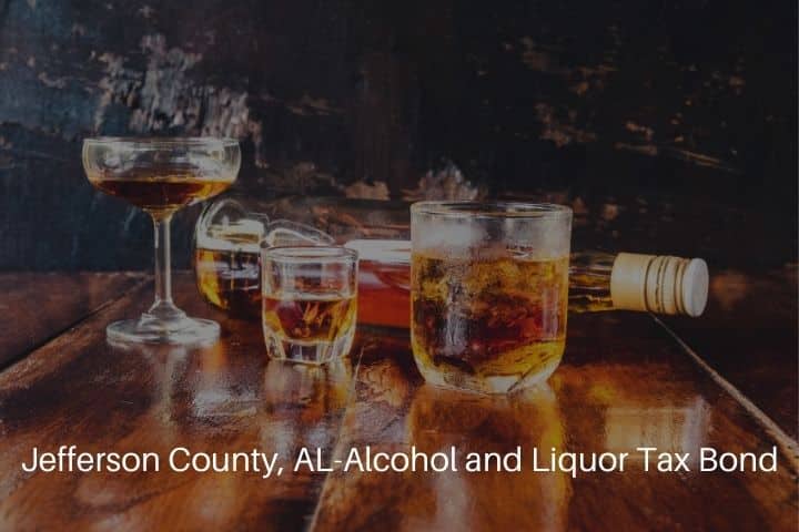 Jefferson County, AL-Alcohol and Liquor Tax Bond - Liquor glass and liquor bottles on wooden table.