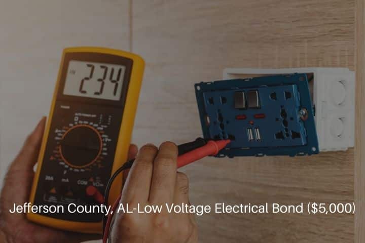 Jefferson County, AL-Low Voltage Electrical Bond ($5,000)-Using a digital meter to measure the voltage at an electrical outlet.