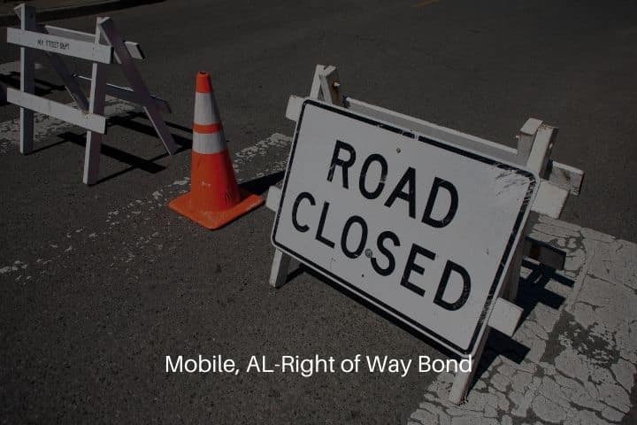 Mobile, AL-Right of Way Bond-Road closed sign and traffic cone on asphalt street.