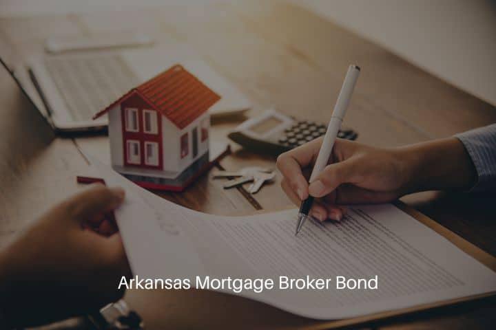 Arkansas Mortgage Broker Bond - The House taker signs the loan document to homeownership with the broker at the table.