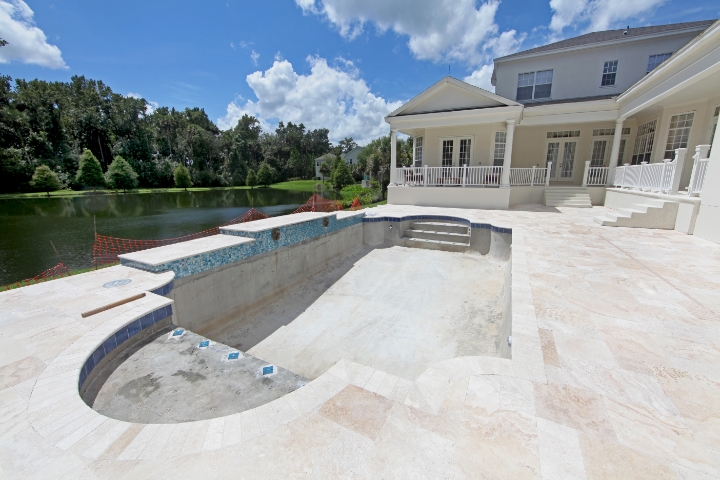 Palm Beach County, FL - Swimming Pool Construction ($10,000) Bond - A swimming pool under construction beside the lake.