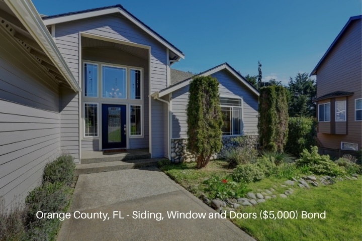 Orange County, FL - Siding, Window and Doors ($5,000) Bond - Blue siding house with elegant front door and side windows.