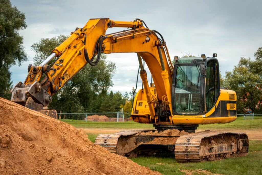 Fairfield, CT - Excavator Bond - Yellow excavator truck at construction site.