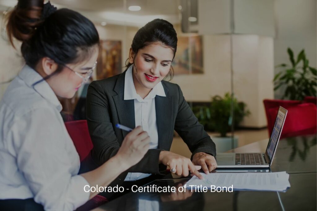 Colorado - Certificate of Title Bond - Indian female worker helping her client signing the application document.