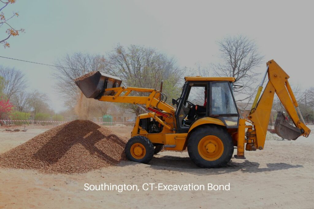 Southington, CT-Excavation Bond - A backhoe is working with gravel at the construction site.