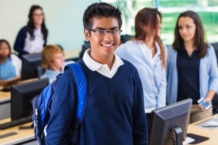 Connecticut Private Occupational School Bond - Intelligent young Indian student in private college prep school.