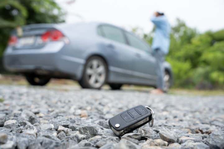 California Motor Vehicle Ownership - Lost Title Bond - Lost car keys on the ground. Car keys dropped on the rocky ground.