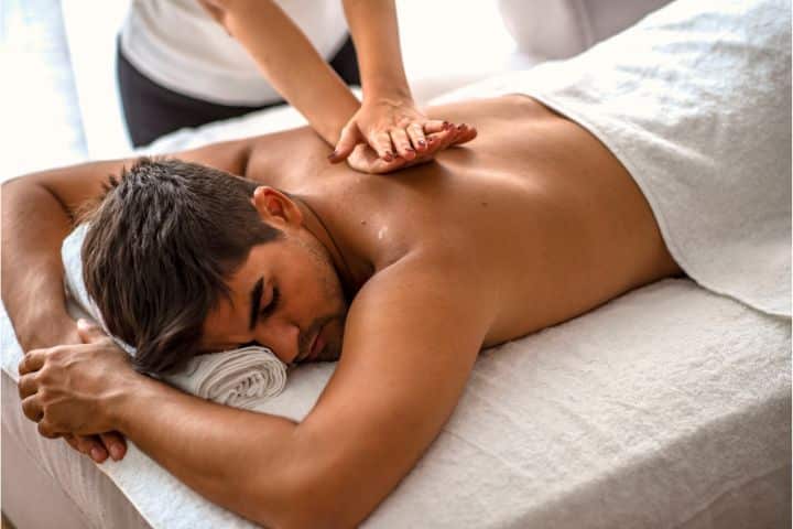 Sacramento, CA - Somatic Practitioners Establishment (Massage) $100,000 Bond - Man relaxing on the massage table receiving massage.