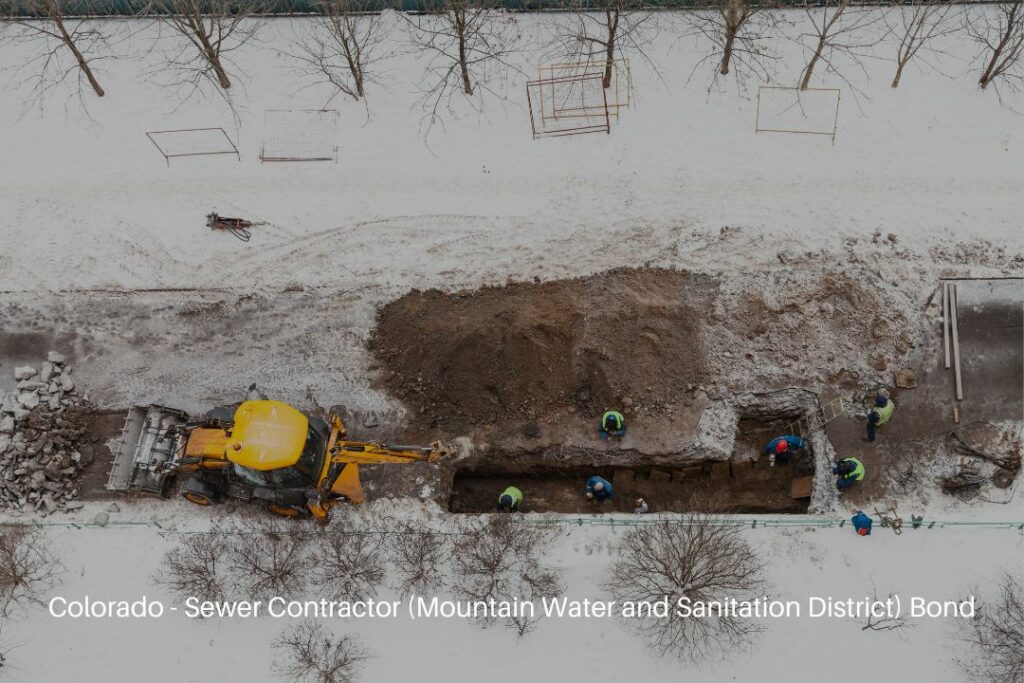 Colorado - Sewer Contractor (Mountain Water and Sanitation District) Bond - Road workers changing sewer pipes in winter days.