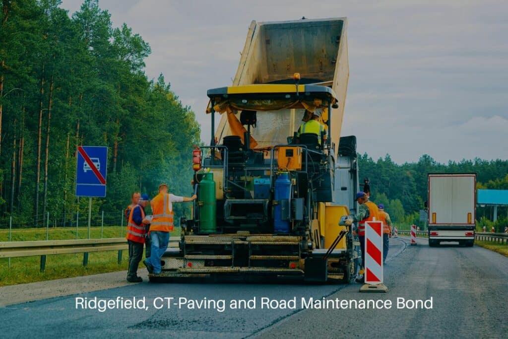 Ridgefield, CT-Paving and Road Maintenance Bond - Road roller tractor in roadway. Auto paving vehicle at work on driveway.