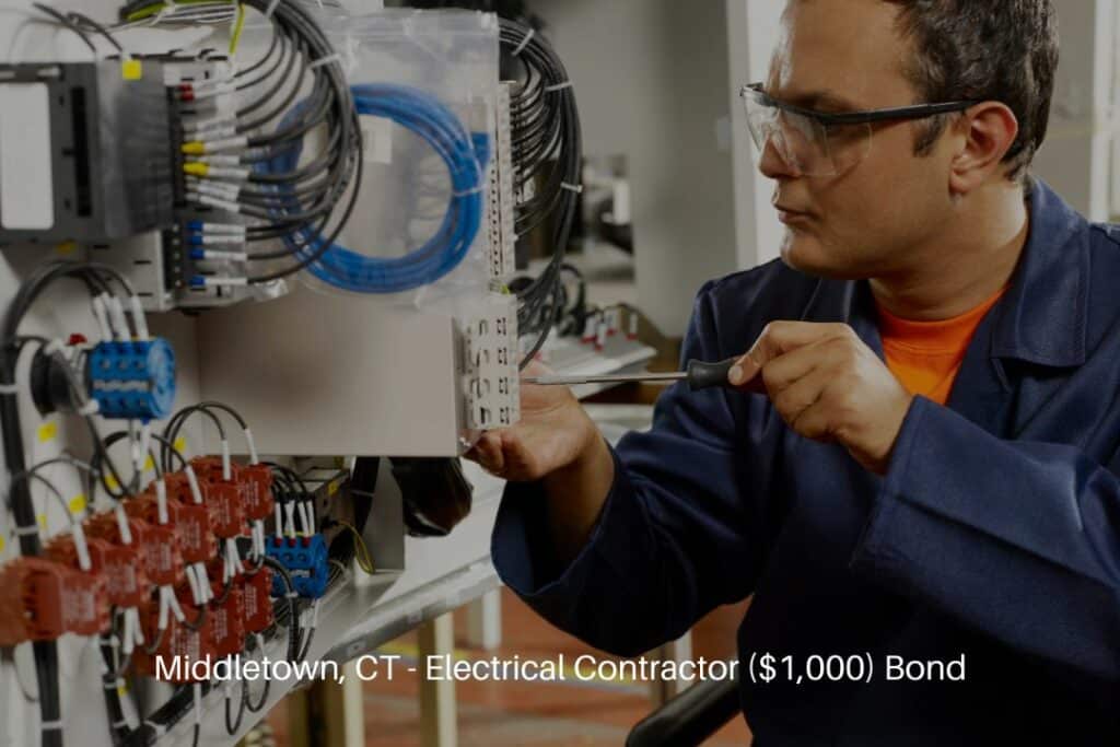 Middletown, CT - Electrical Contractor ($1,000) Bond - In a factory fuse box, a technician is working.