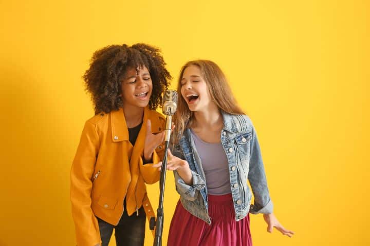 California Fee-Related Talent Service $50,000 Bond - Teenage girls with microphone singing against a color background.