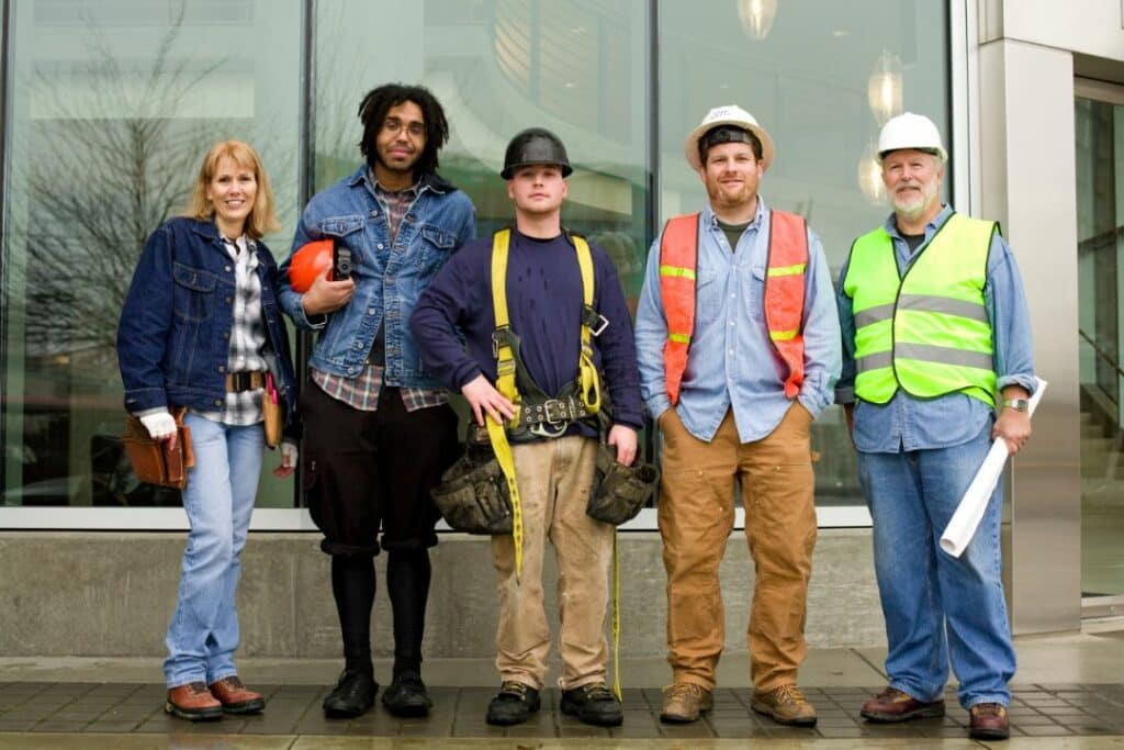 IBEW Local 302 Fringe Benefits Bond - Construction worker with their uniform and safety gears posing in front of the camera.