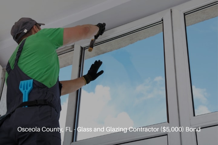 Osceola County, FL - Glass and Glazing Contractor ($5,000) Bond - Worker installing double glazing window indoors.