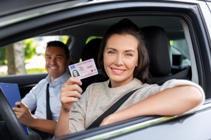 FL - Third Party Driver License Testing Class E Knowledge Exams ($200,000) Bond - A car driving instructor and the driver with her license.