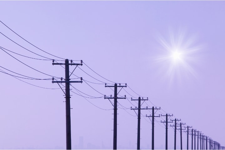 City of Ocala, FL - Utility Services Deposit Bond - Electrical utility poles and sunset.