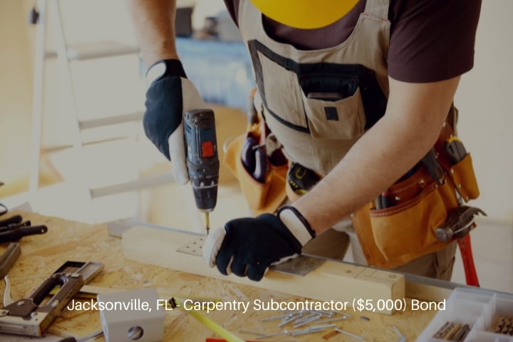 Jacksonville, FL - Carpentry Subcontractor ($5,000) Bond - Male carpenter in working clothes in a construction site.