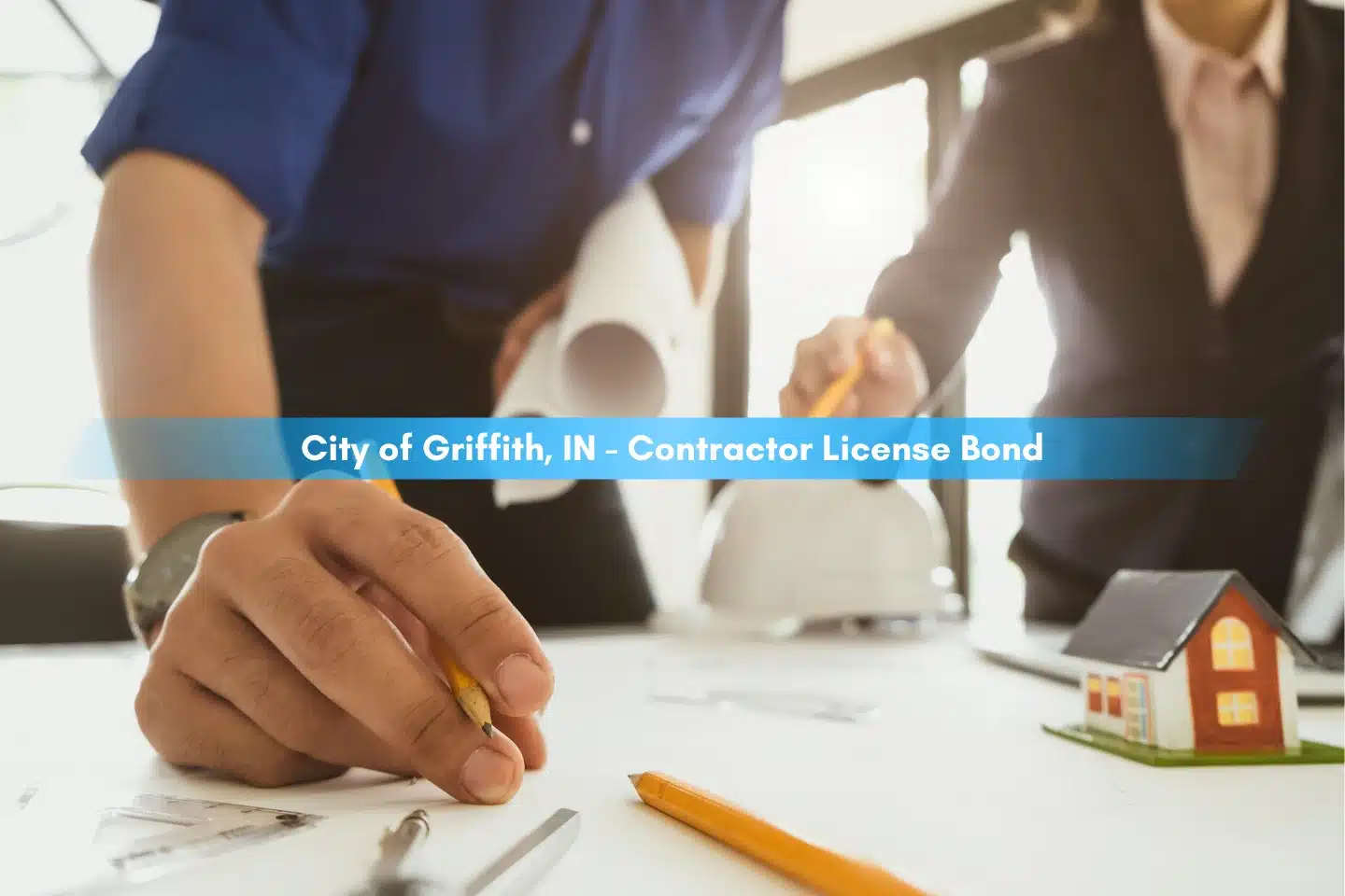 City of Griffith, IN - Contractor License Bond - Engineer meeting for architectural project. Working with partner and engineering tools on workplace.