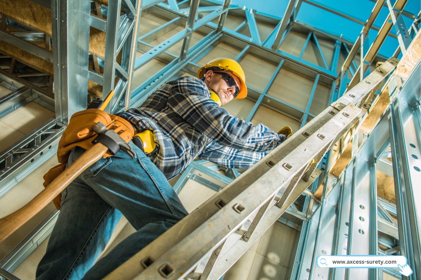 Construction worker with a hammer hanging on his tool belt stepping up the extension ladder.